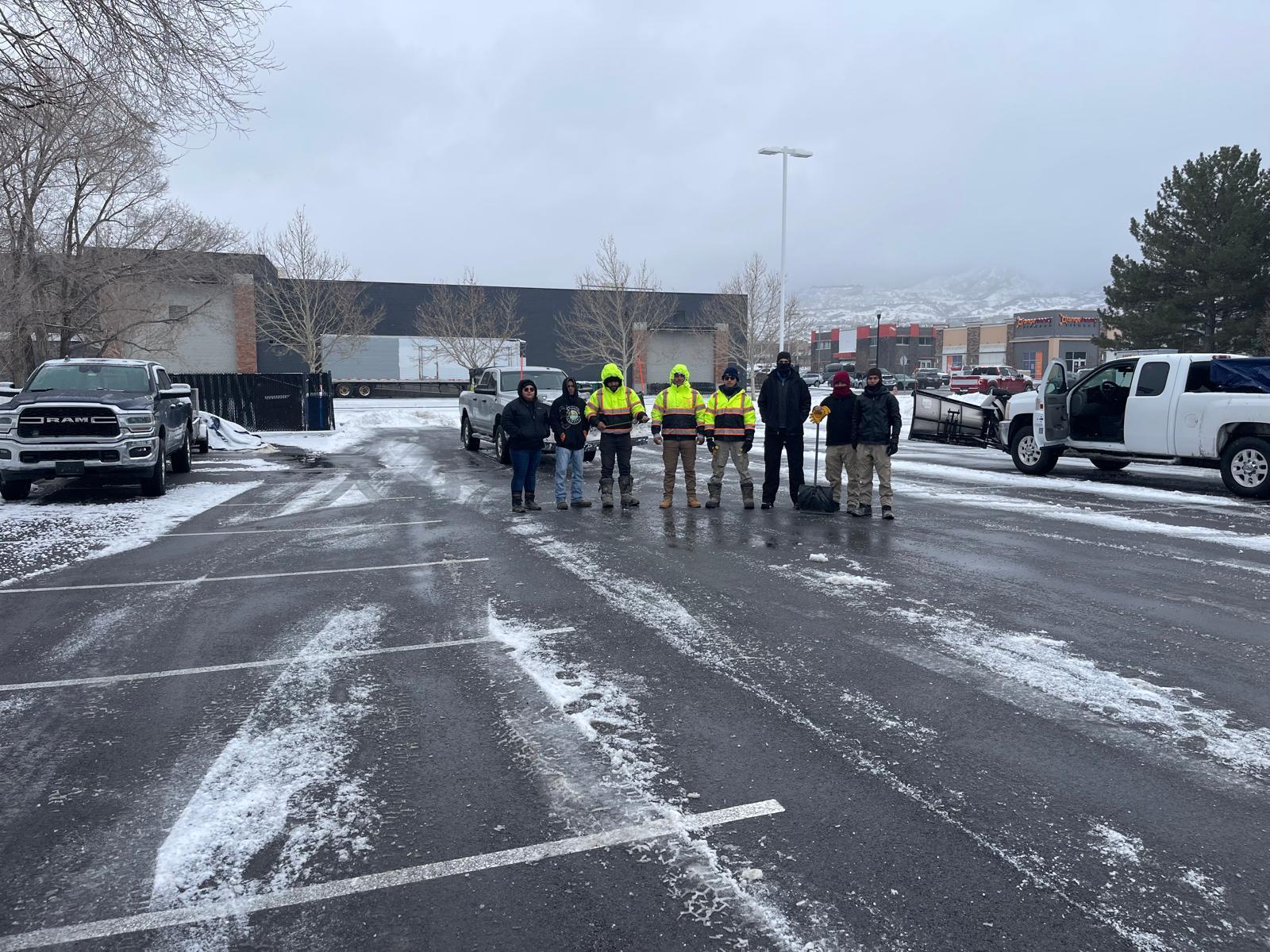 Field crew staged with plow fleet before storm