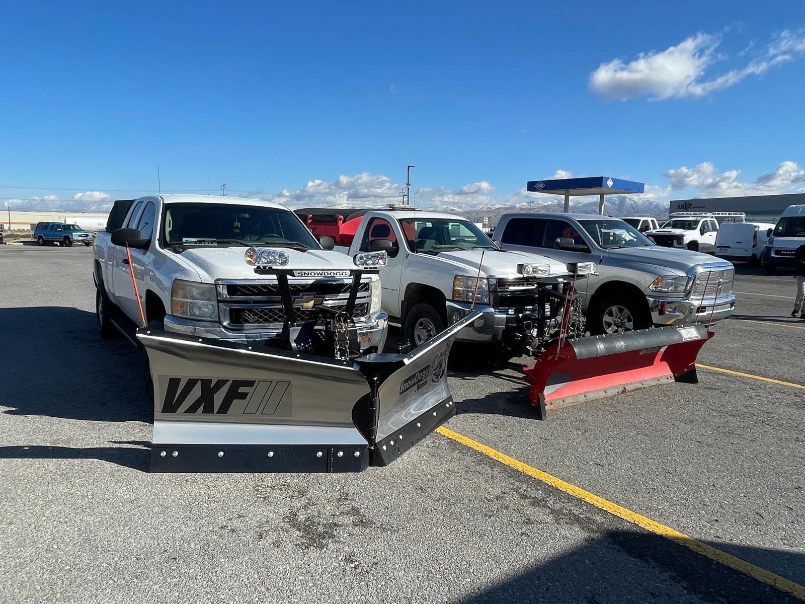 Three plow trucks with VXF and SnowDogg blades
