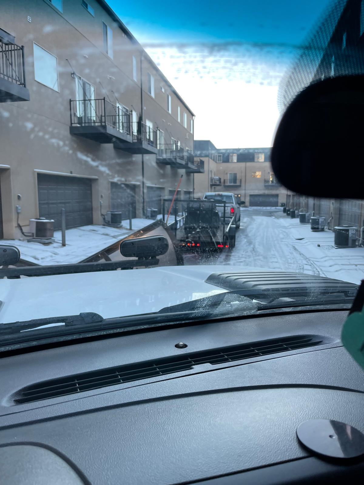 In-cab view of active snow plowing operation