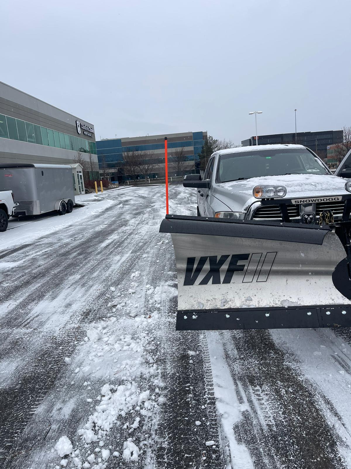 Chevrolet plow truck with VXF blade at commercial site